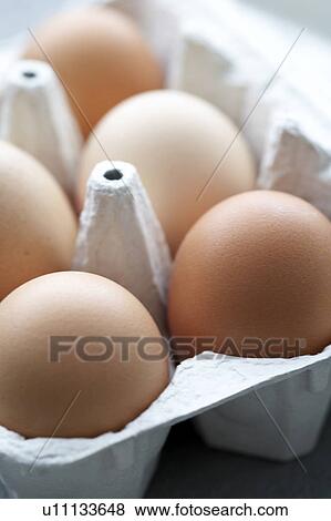 Stock Photo - Eggs in an egg carton. Fotosearch