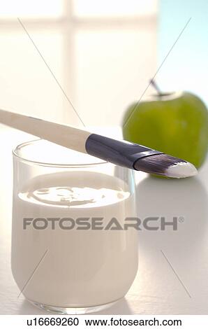 Stock Image - Facial mask with yoghurt, an apple and a brush. Fotosearch