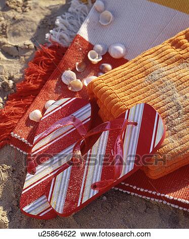 Stock Image - flip-flops und towels. Fotosearch