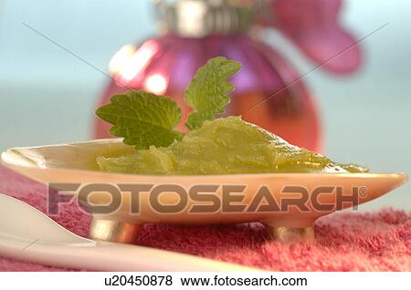 Stock Photo - Foot balm with lavender, sage and rosemary. Fotosearch