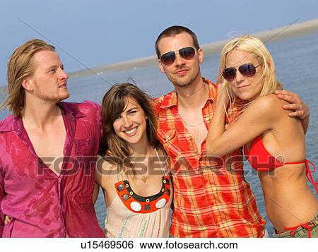 Four friends at the seaside View Large Photo Image Stock Photograph - Four friends at the seaside. Fotosearch