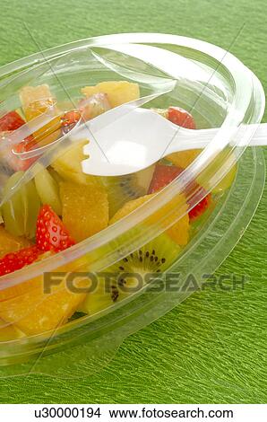 Picture - Fruit salad in a plastic bowl. Fotosearch