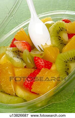 Stock Photo - Fruit salad in a plastic bowl. Fotosearch