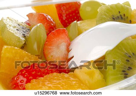 Fruit salad in a plastic bowl View Large Photo Image Stock Photo - Fruit salad in a plastic bowl. Fotosearch