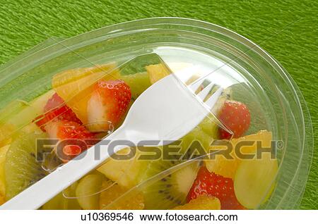 Stock Photograph - Fruit salad in a plastic bowl. Fotosearch
