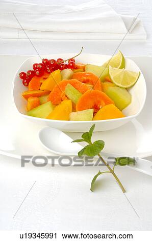Fruit salad in a white porcelain bowl View Large Photo Image Stock Image - Fruit salad in a white porcelain bowl. Fotosearch
