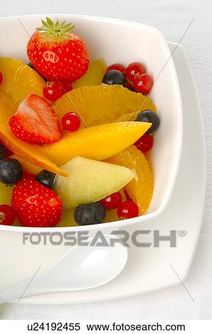Stock Photography - Fruit salad in a white porcelain bowl. Fotosearch