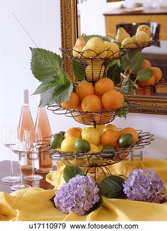 Fruit, wine and flowers on sideboard View Large Photo Image Stock Photo - Fruit, wine and flowers on sideboard. Fotosearch