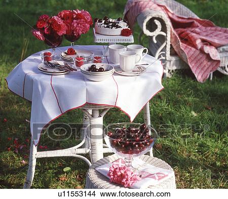 Picture - Garden table with cherries. Fotosearch