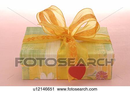 Gift and a red heart View Large Photo Image Stock Image - Gift and a red heart. Fotosearch