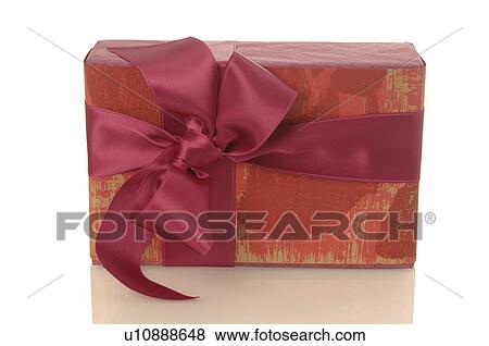 Gift with red ribbon and bow View Large Photo Image Stock Photo - Gift with red ribbon and bow. Fotosearch