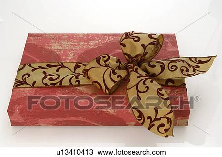 Gift with ribbon and bow View Large Photo Image Stock Image - Gift with ribbon and bow. Fotosearch