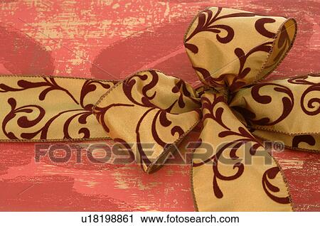Stock Image - Gift with ribbon and bow. Fotosearch