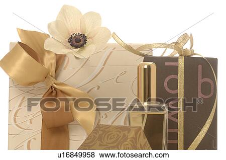 Stock Photo - Gifts and small perfume bottle. Fotosearch