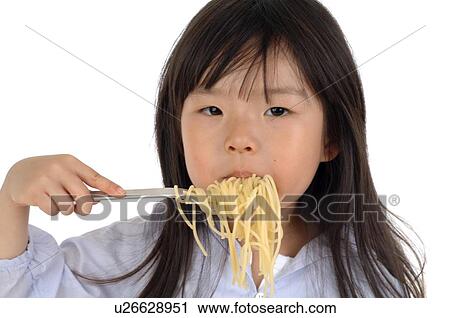 Stock Image - Girl eating spaghetti. Fotosearch