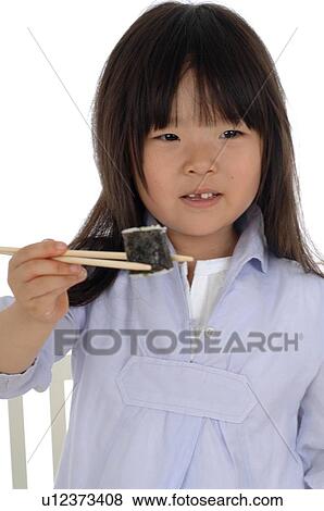 Girl eating sushi View Large Photo Image Stock Photo - Girl eating sushi. Fotosearch
