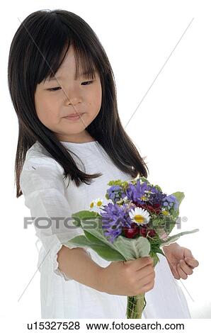 Stock Photo - Girl holding bunch of flowers. Fotosearch