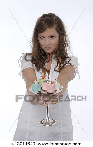 Girl with Petit Fours View Large Photo Image Stock Photo - Girl with Petit Fours. Fotosearch