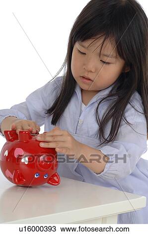 Stock Image - Girl with piggy bank. Fotosearch