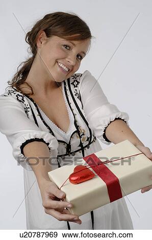 Girl with present View Large Photo Image Stock Photo - Girl with present. Fotosearch
