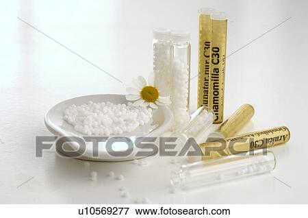 Stock Photo - Globules with camomile. Fotosearch
