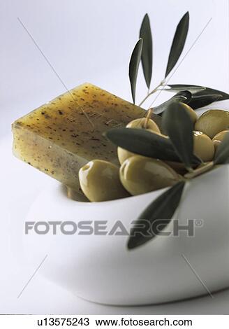 Green olives and olive soap in a white bowl View Large Photo Image Stock Image - Green olives and olive soap in a white bowl. Fotosearch