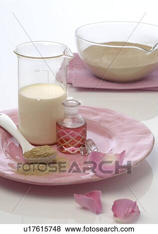 Stock Photo - Healing earth and rose oil. Fotosearch