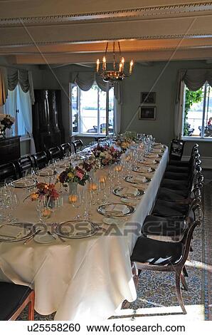 Stock Image - Laid table in restaurant. Fotosearch