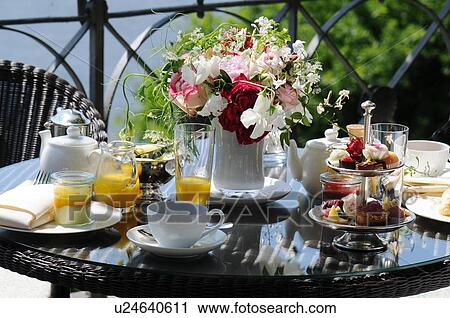 Stock Image - Laid table outdoors. Fotosearch