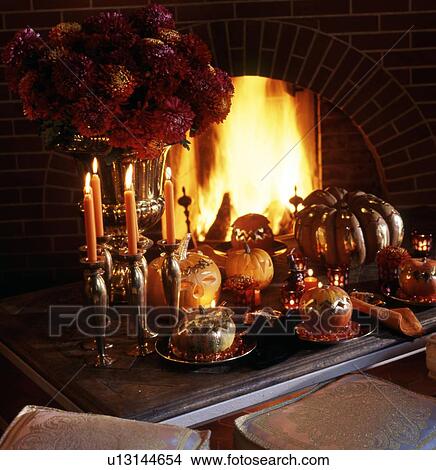 Laid table with pumpkins at the fireplace View Large Photo Image Picture - Laid table with pumpkins at the fireplace. Fotosearch