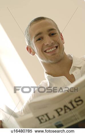 Stock Photography - Laughing man reading the paper. Fotosearch
