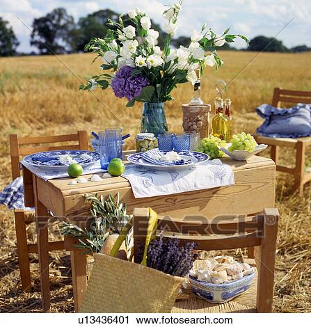 Stock Image - Layed table in nature. Fotosearch