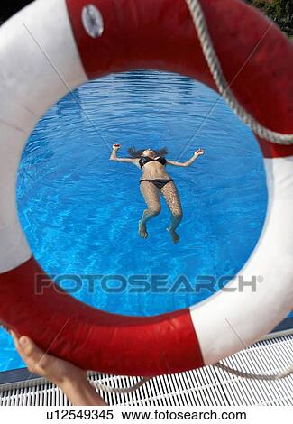 Life ring and teenage girl in swimming pool View Large Photo Image Stock Photography - Life ring and teenage girl in swimming pool. Fotosearch