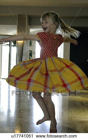 Little girl in a yellow and red checked dress View Large Photo Image Stock Image - Little girl in a yellow and red checked dress. Fotosearch