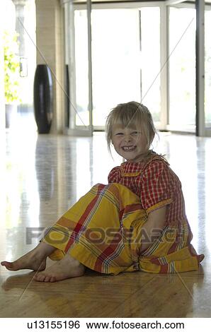 Little girl in a yellow and red checked dress View Large Photo Image Stock Photograph - Little girl in a yellow and red checked dress. Fotosearch