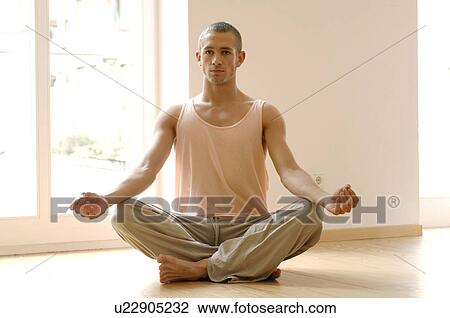 Man doing Yoga exercises View Large Photo Image Stock Image - Man doing Yoga exercises. Fotosearch