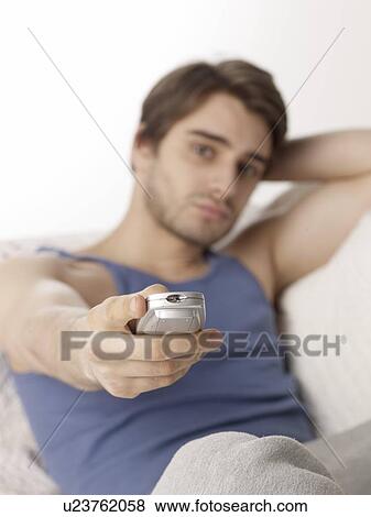Man watching TV View Large Photo Image Stock Photo - Man watching TV. Fotosearch