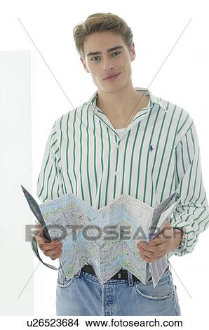 Picture - Man with folded up city map. Fotosearch