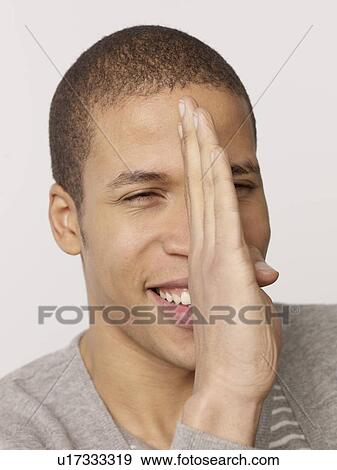 Stock Photo - Man with hand in face. Fotosearch