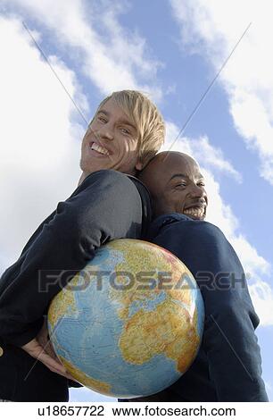 Men with globe View Large Photo Image Stock Image - Men with globe. Fotosearch