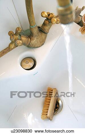 Stock Image - Nailbrush in washbasin. Fotosearch