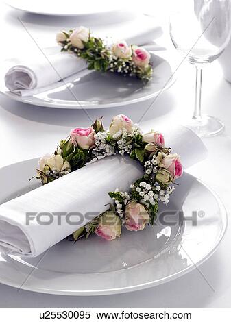 Napkins decorated with coronals of roses and Baby`s breath View Large Photo Image Stock Photography - Napkins decorated with coronals of roses and Baby`s breath. Fotosearch