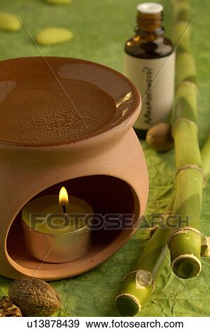 Nutmeg oil aroma lamp View Large Photo Image Stock Photo - Nutmeg oil aroma lamp. Fotosearch