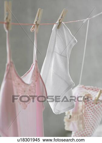 Pale pink nightdress and shorts at a clothesline View Large Photo Image Stock Photography - Pale pink nightdress and shorts at a clothesline. Fotosearch