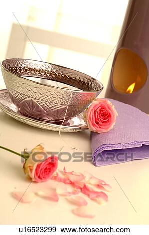 Stock Photo - Pink roses and a silver teacup. Fotosearch