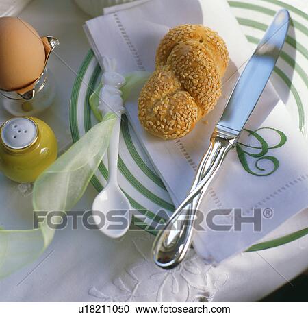 Stock Image - Place setting with rolls and boiled egg. Fotosearch