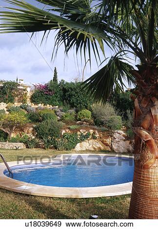 Stock Photo - pool with rockery. Fotosearch