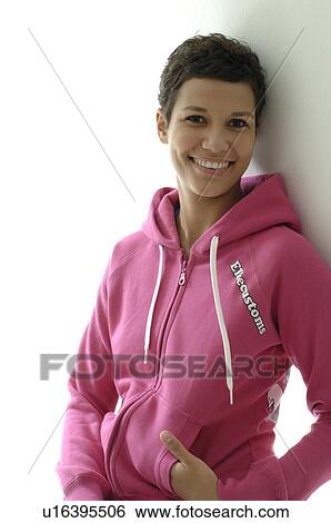 Stock Photograph - Portrait of a woman with red sweatshirt. Fotosearch