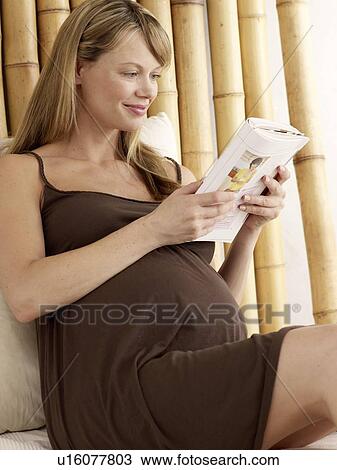 Pregnant woman reading book View Large Photo Image Stock Image - Pregnant woman reading book. Fotosearch