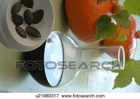 Stock Photo - Pumpkin seed oil and pumpkins. Fotosearch